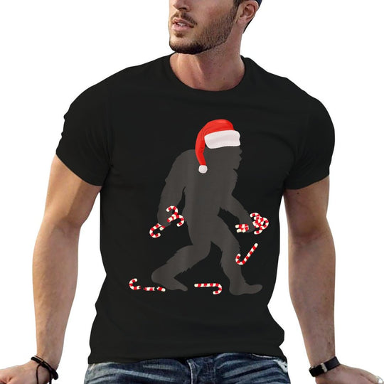Funny Christmas Bigfoot with Santa Hat Carrying Candy Canes  Odor-resistant T-Shirt