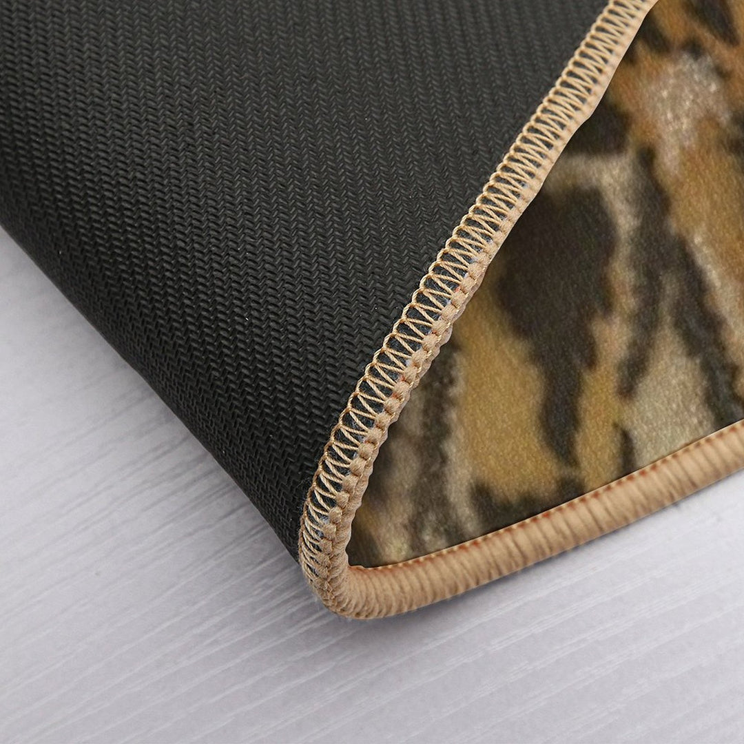 An Airedale Terrier Stands in The Meadow  Stain-Proof Bath Mat